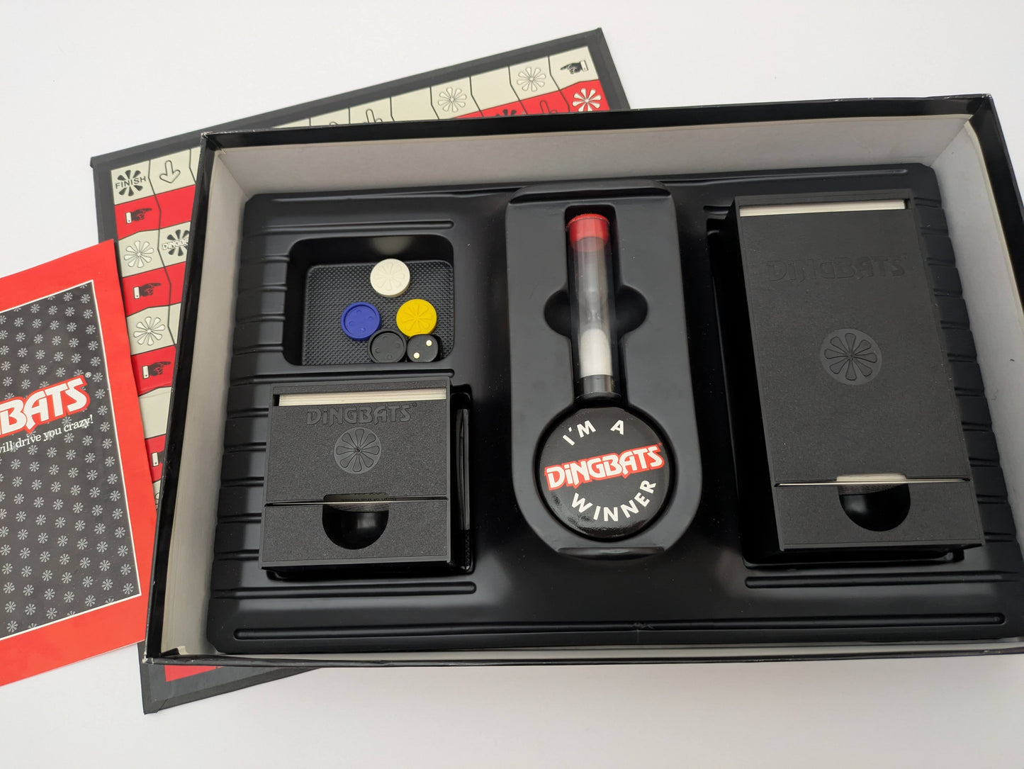 Bring family fun to the table with Dingbats (1987) a clever game of riddles and wordplay.