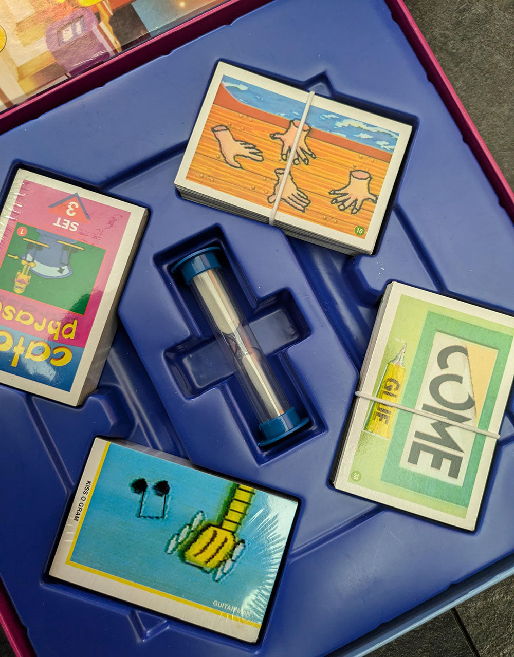 Complete Catch Phrase Board Game (2005) setup with game board, phrase cards, and playing pieces ready for family-friendly gameplay.