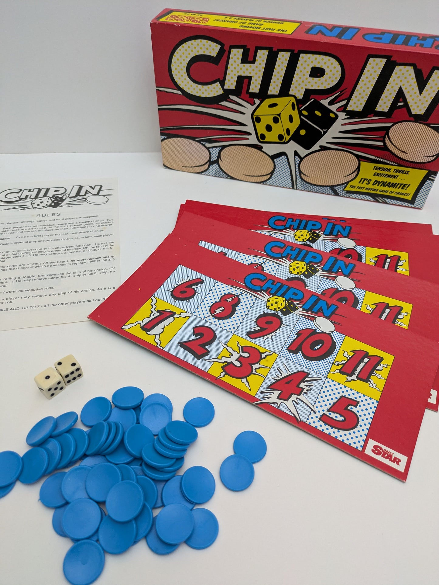 Complete Chip In (1988) setup with dice, numbered boards, and colourful chips ready for fast-paced family gameplay.