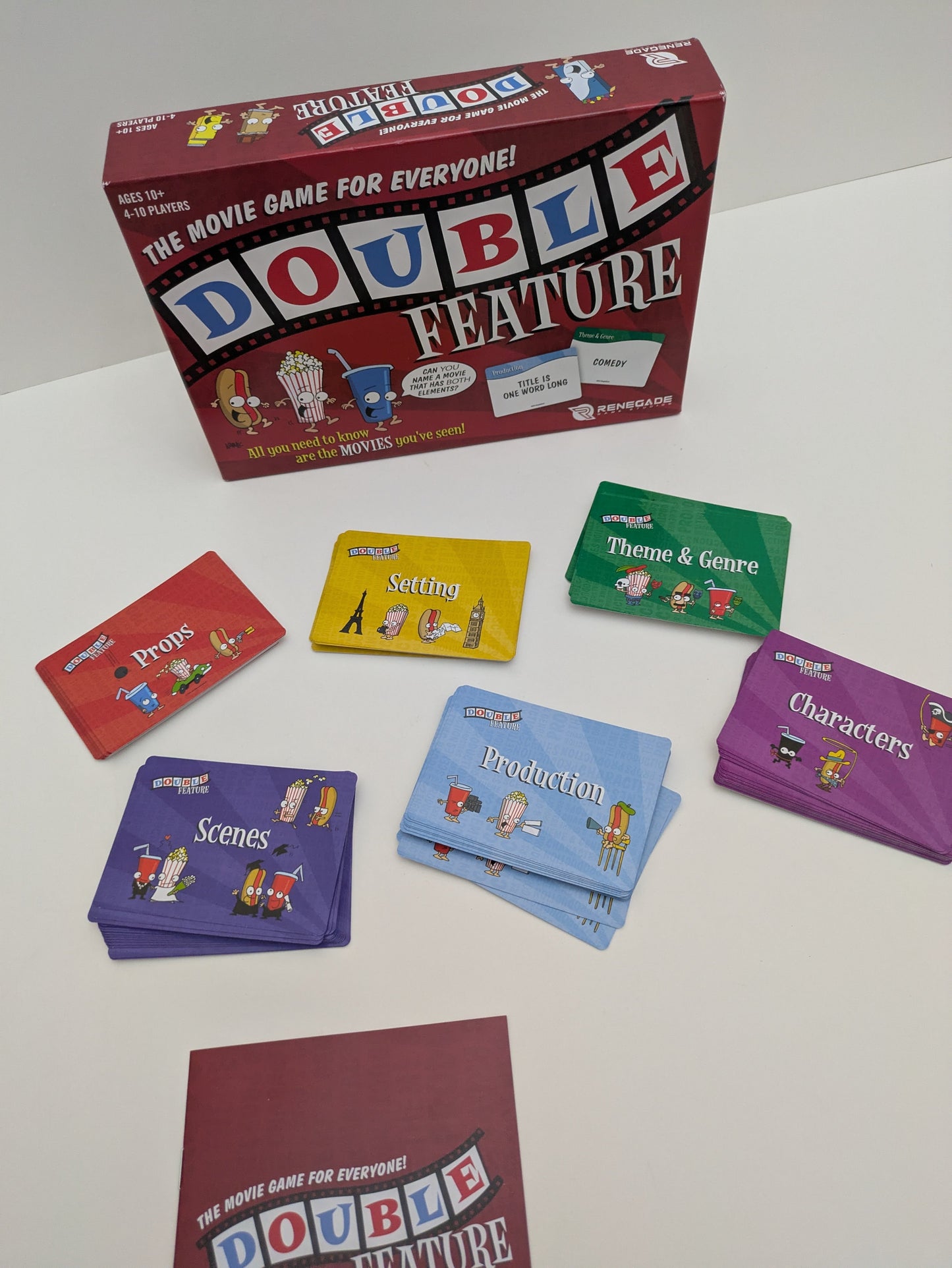 Double Feature game setup with cards arranged in their category piles and players ready to start linking movies.