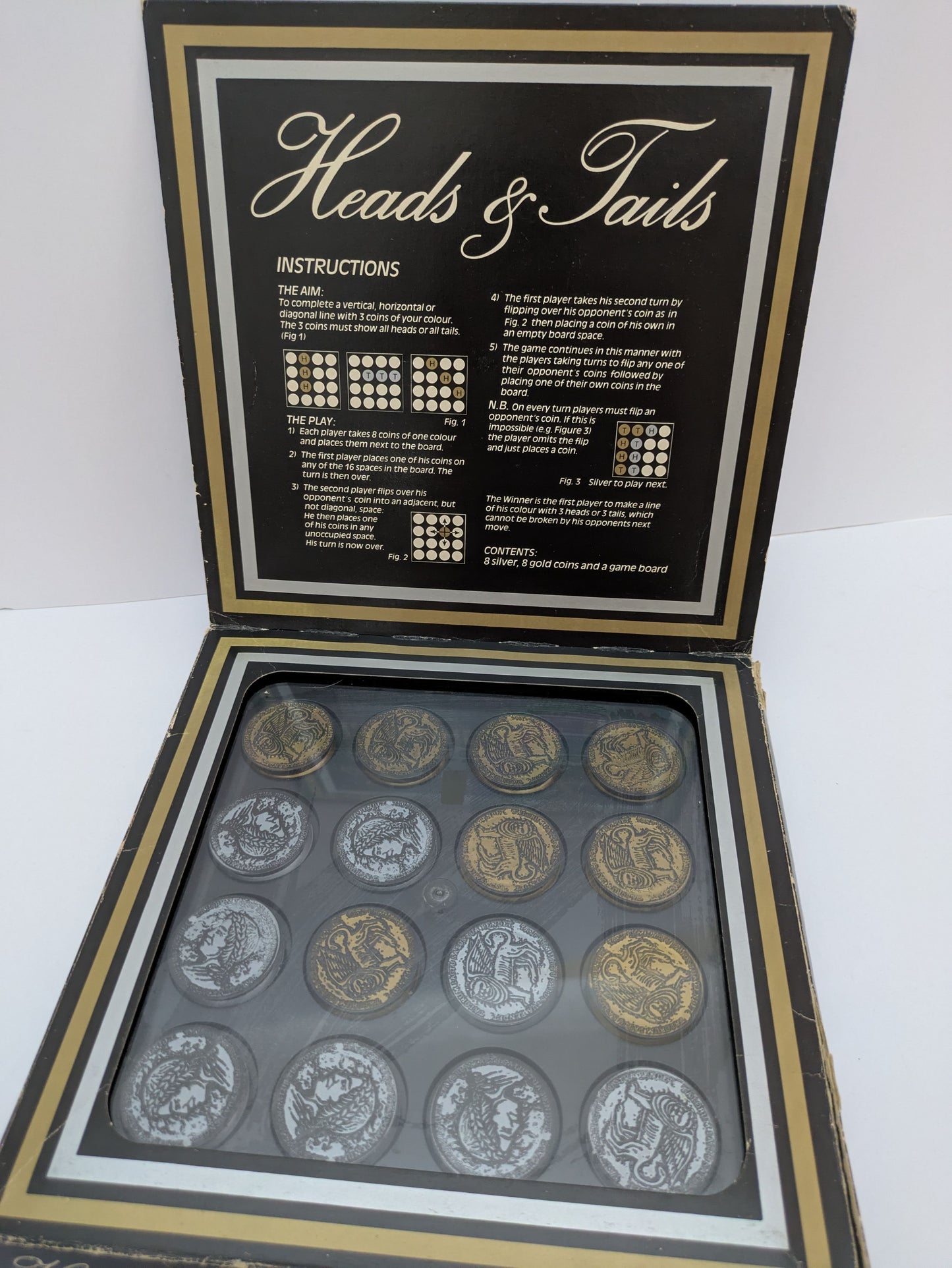Experience the Retro Challenge of Heads & Tails (1981) Classic Strategy Fun