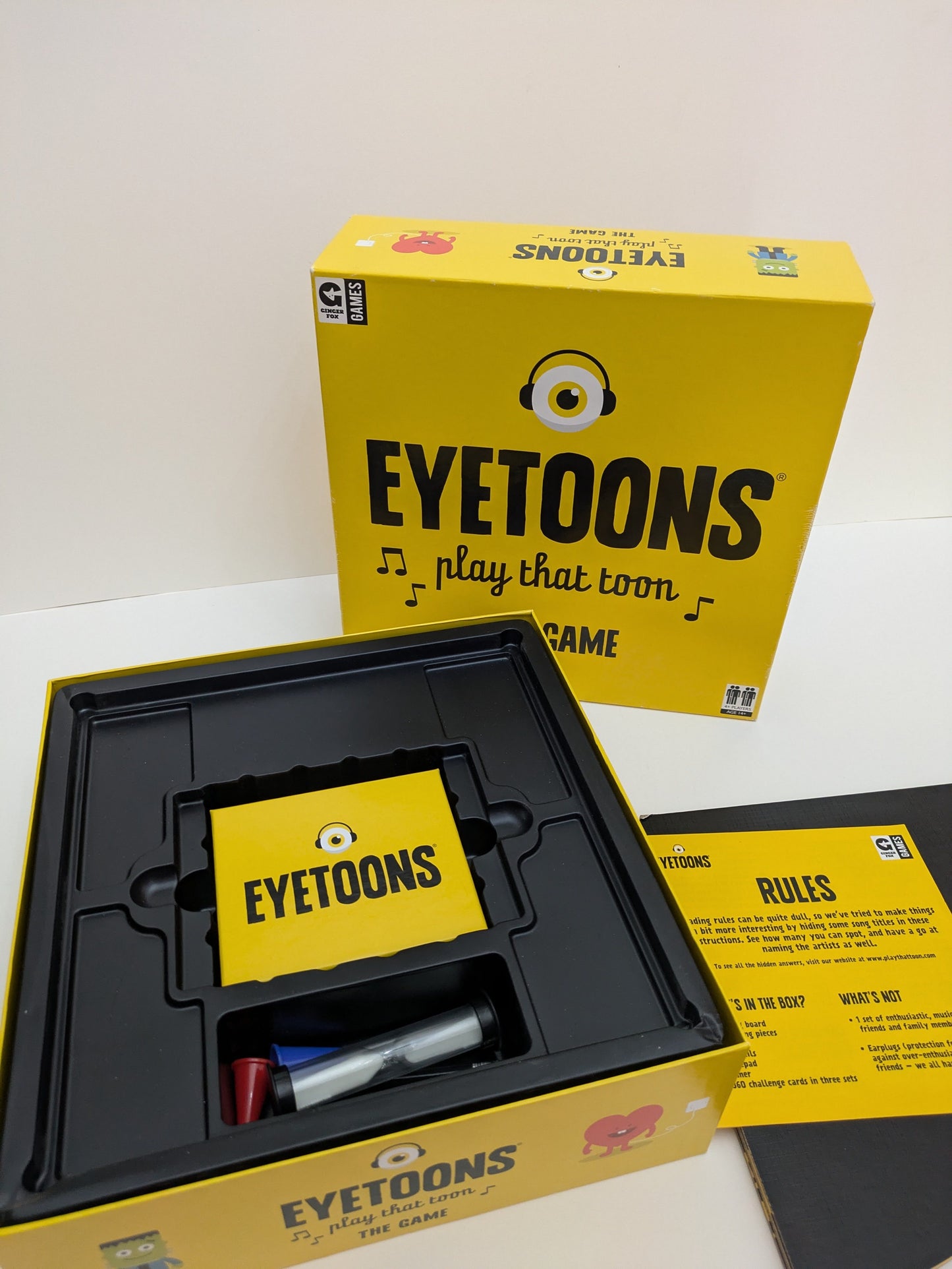 "Complete Eyetoons (2016) game setup with cards, drawing pads, and game board ready for a fun-filled musical trivia and drawing competition."