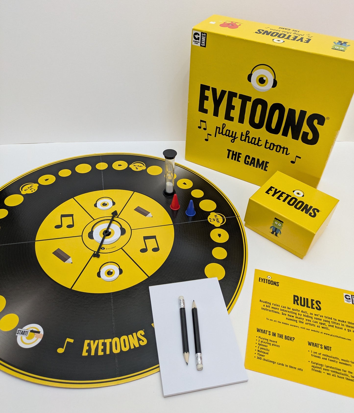 "Complete Eyetoons (2016) game setup with cards, drawing pads, and game board ready for a fun-filled musical trivia and drawing competition."