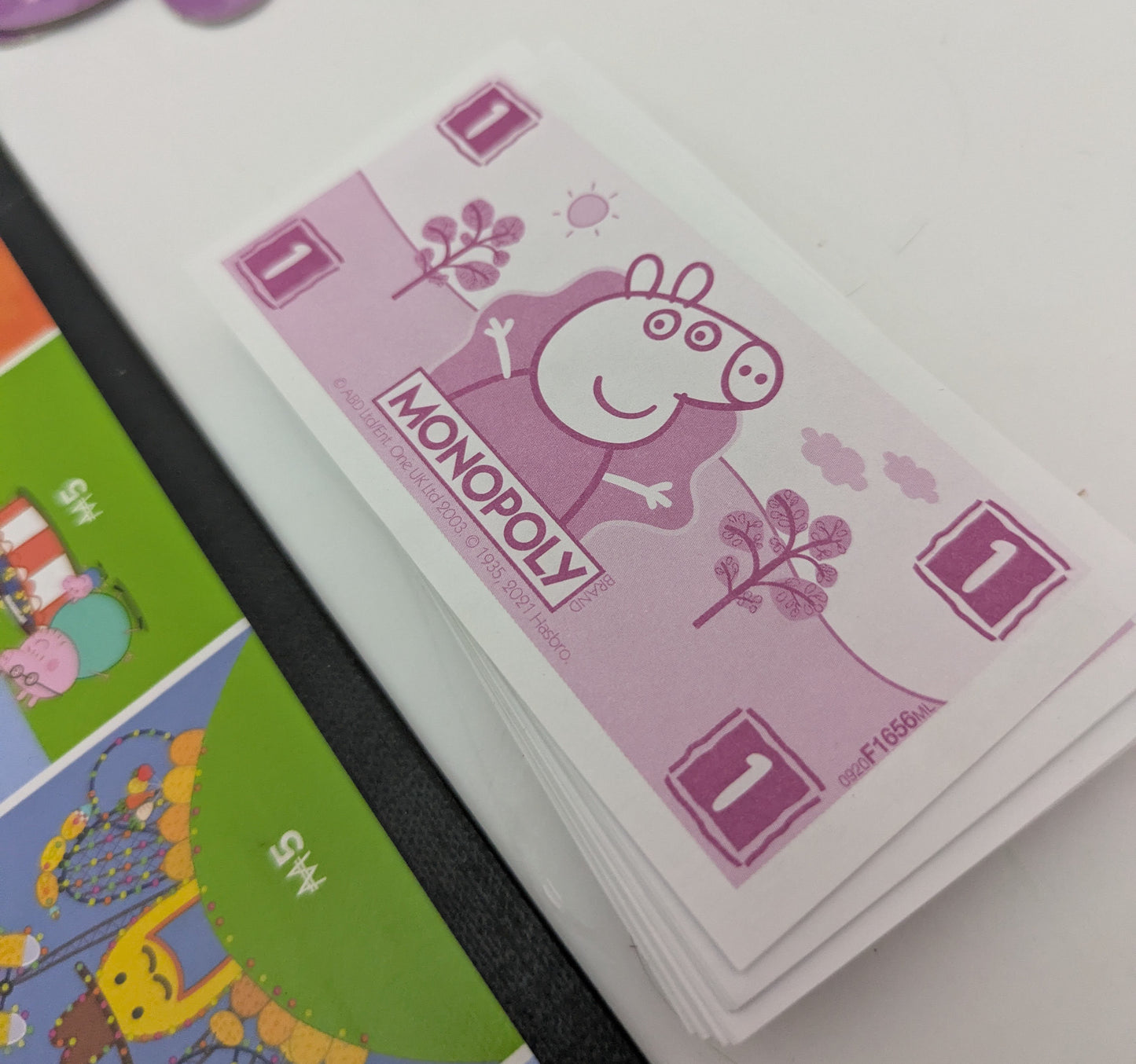 Laugh, learn, and play together with Monopoly Peppa Pig (2003) – the perfect start to a lifetime of board game fun.