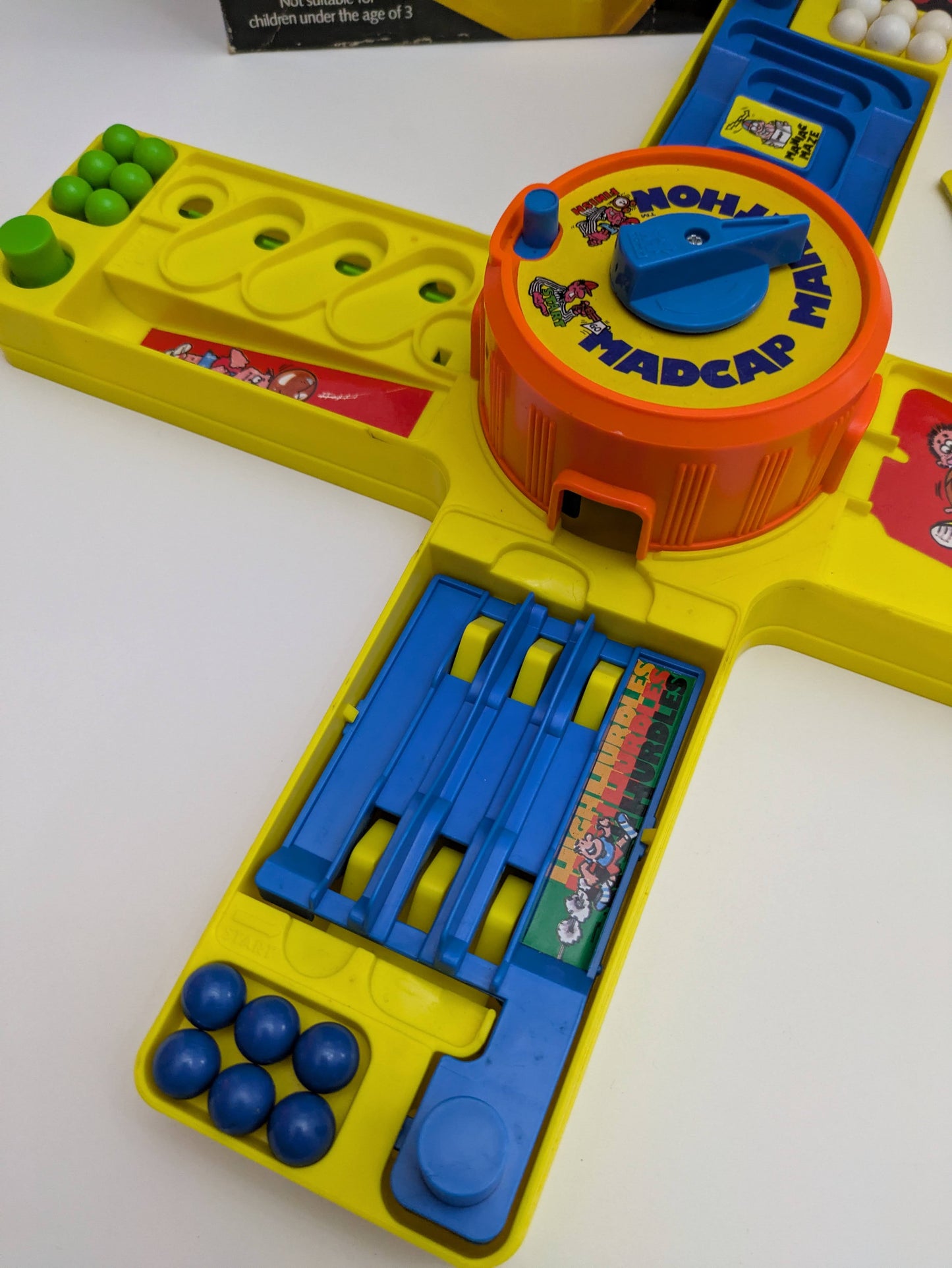 Madcap Marathon (1981) game box featuring colourful obstacle visuals, player controls, and the game logo emphasizing action-packed gameplay.