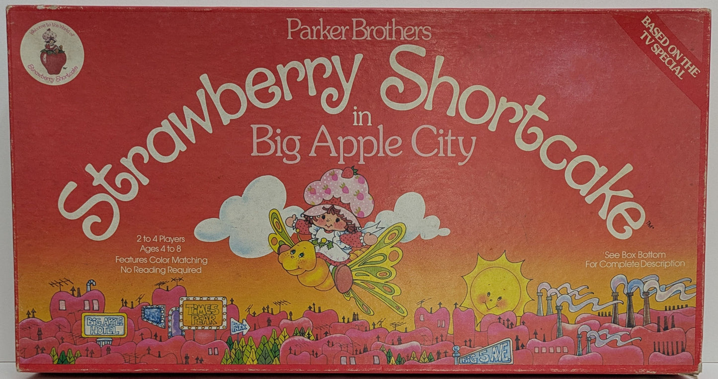Complete setup of Strawberry Shortcake in Big Apple City with game board, character tokens, spinner, and pie cards ready for family-friendly gameplay.