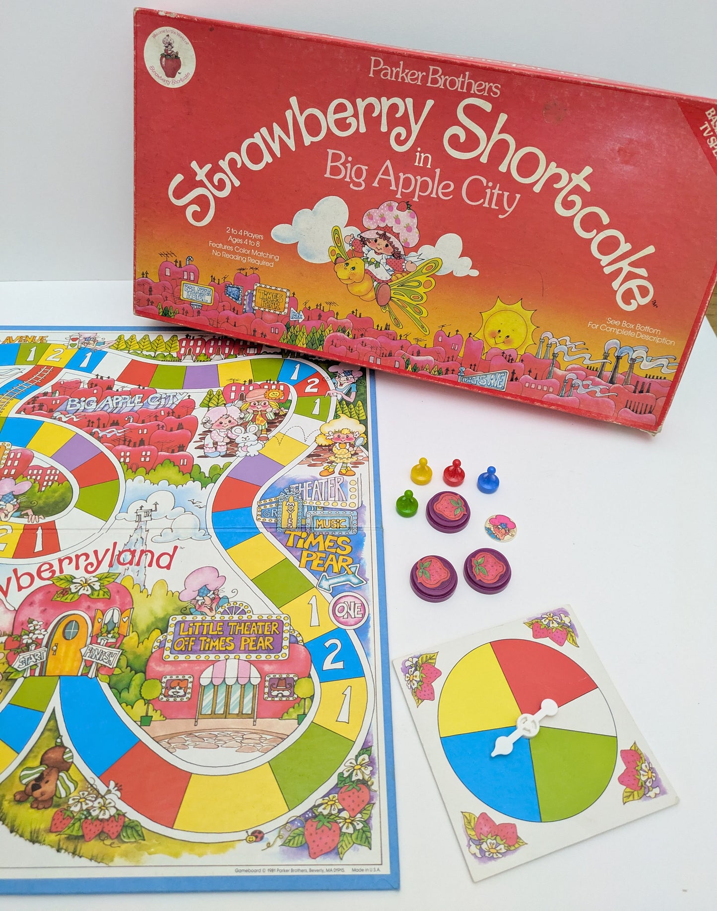 Strawberry Shortcake in Big Apple City game box featuring colourful characters, a whimsical game board, and the game logo highlighting nostalgic gameplay.