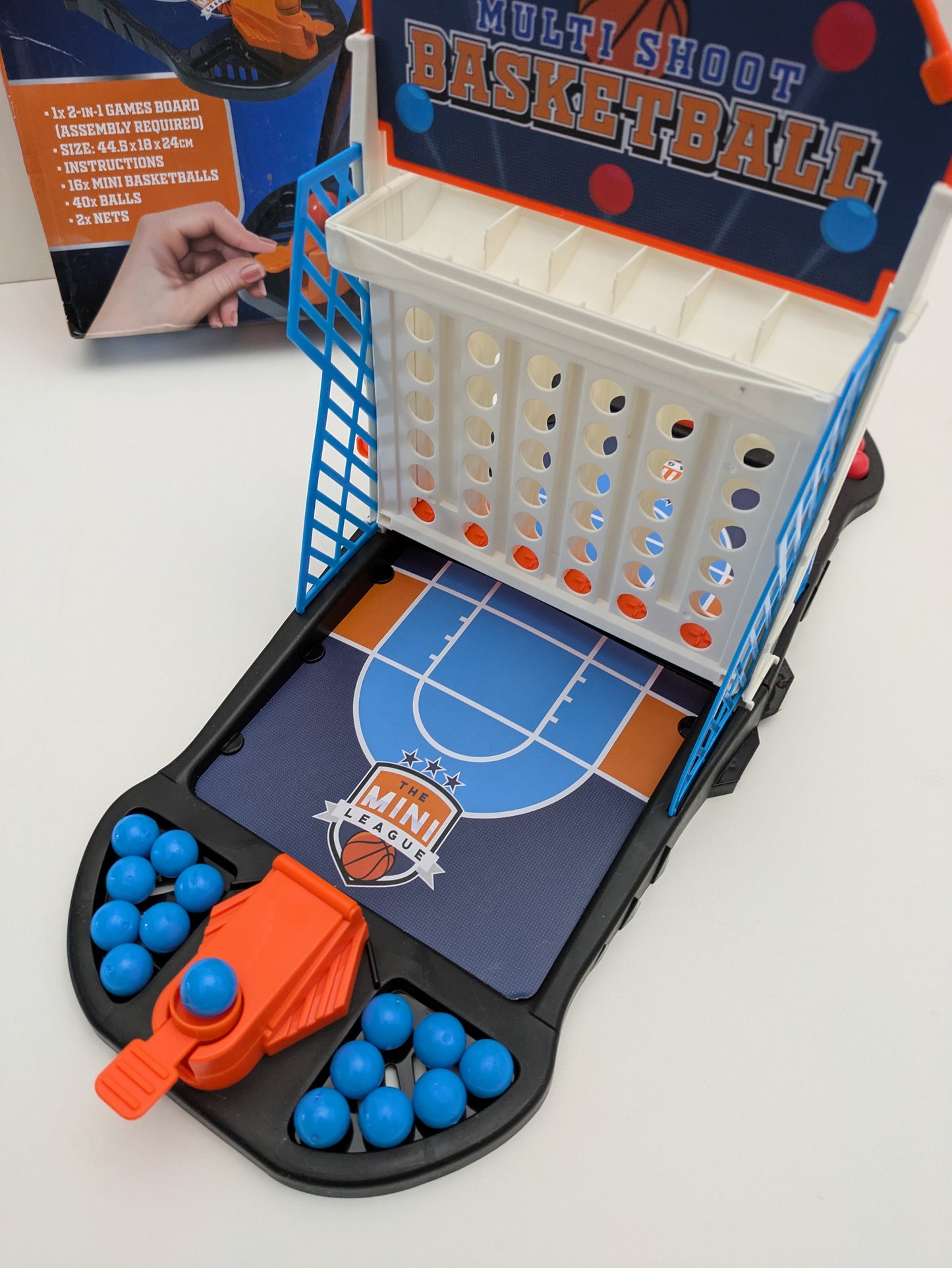 Complete setup of Multi Shoot Basketball with mini basketball hoops, balls, and game board ready for fast-paced family fun.