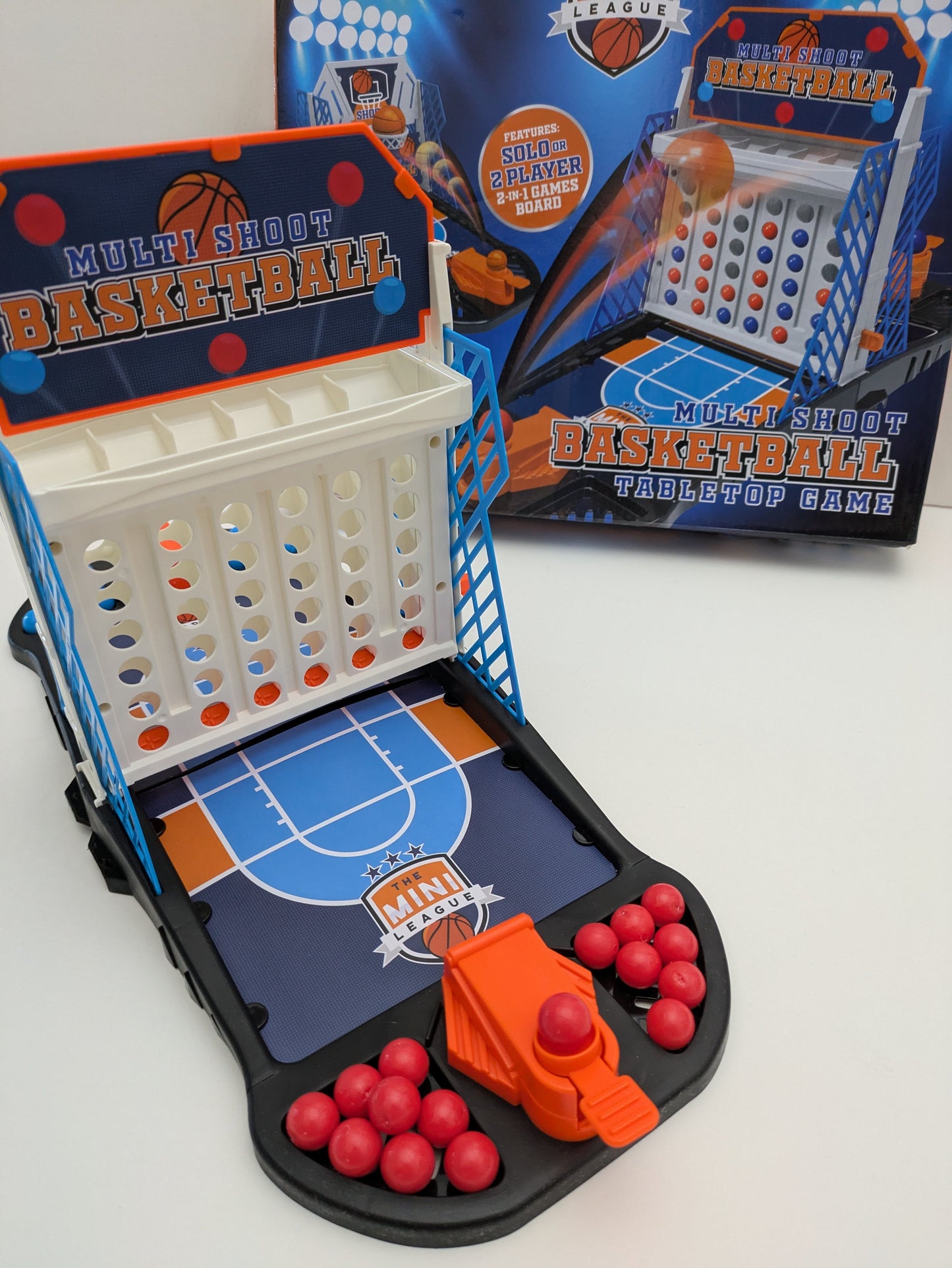 Complete setup of Multi Shoot Basketball with mini basketball hoops, balls, and game board ready for fast-paced family fun.