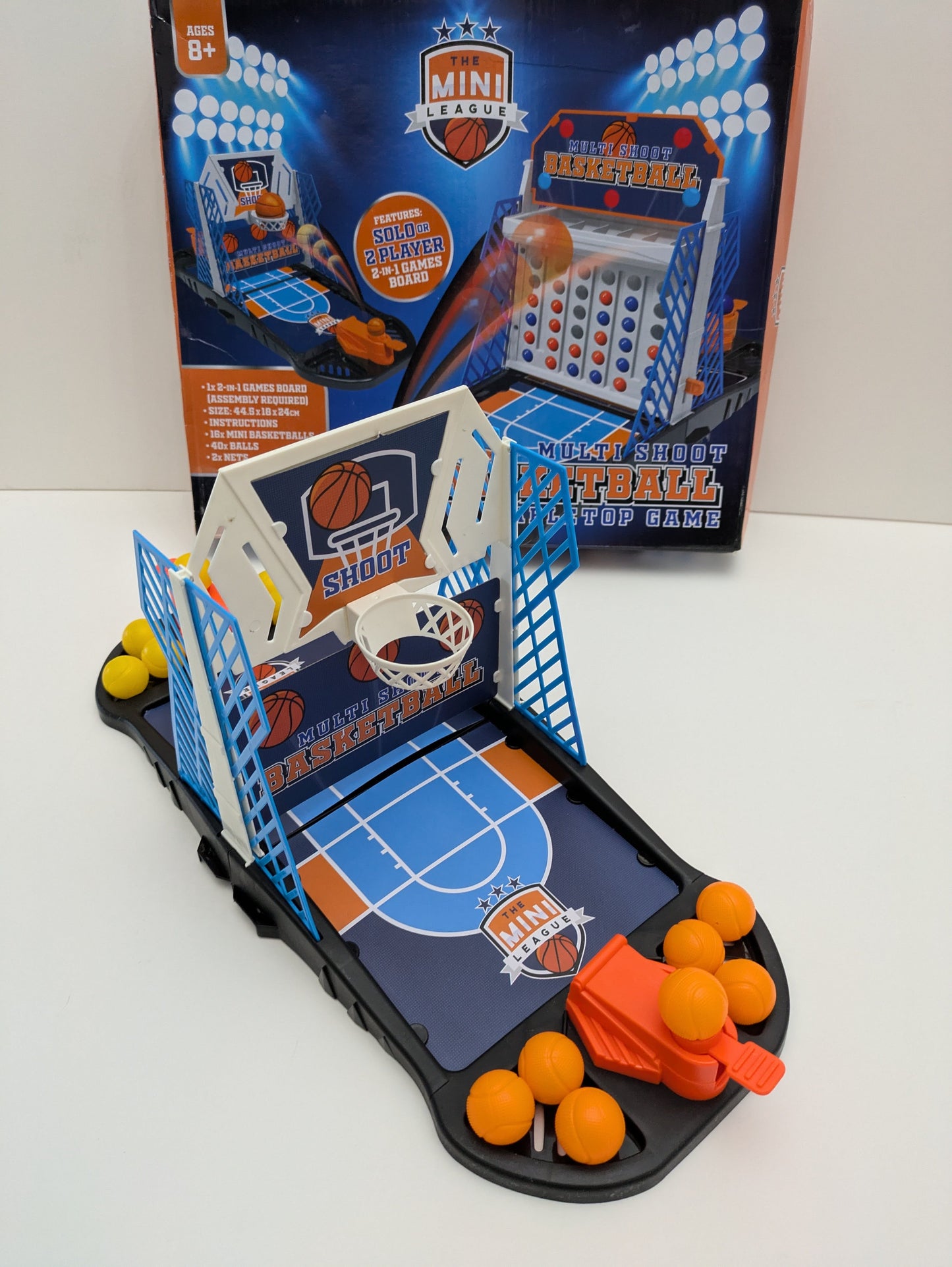 Complete setup of Multi Shoot Basketball with mini basketball hoops, balls, and game board ready for fast-paced family fun.