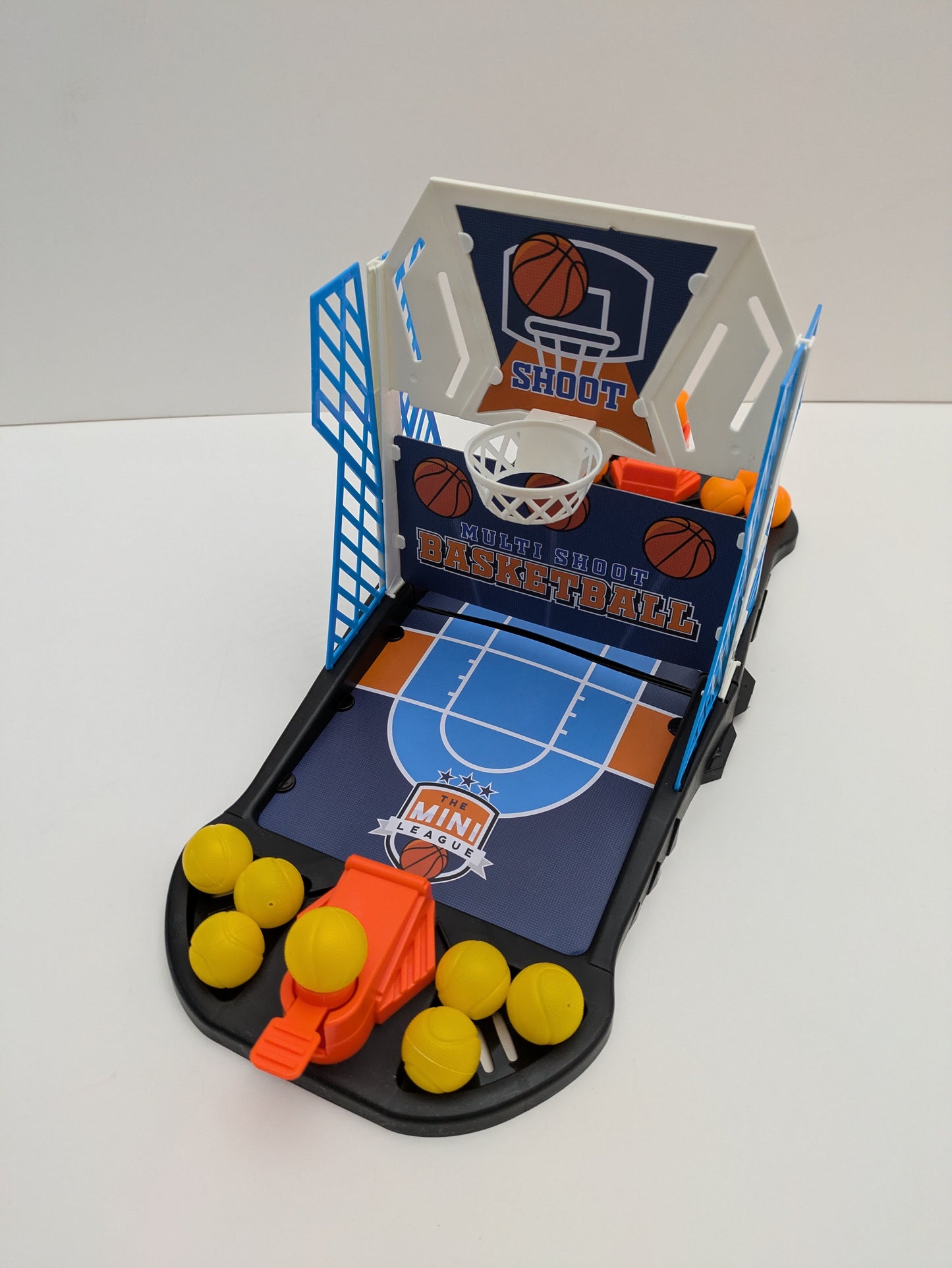 Complete setup of Multi Shoot Basketball with mini basketball hoops, balls, and game board ready for fast-paced family fun.