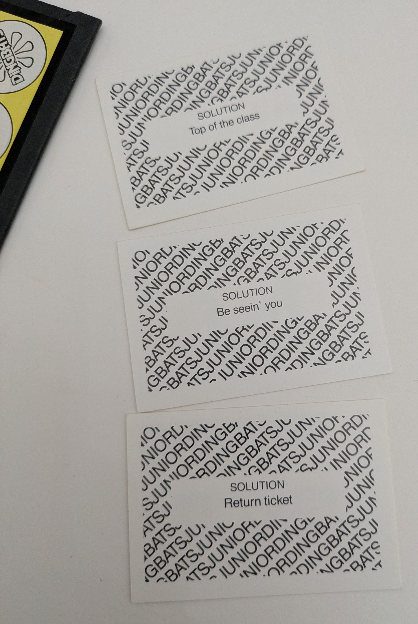 Race to the finish in Junior Dingbats (1988) by solving visual riddles!
