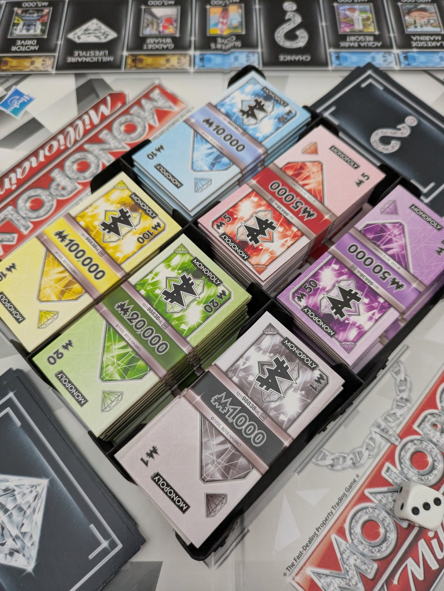 Reach a million first in Monopoly Millionaire (2012) – no bankruptcies needed!