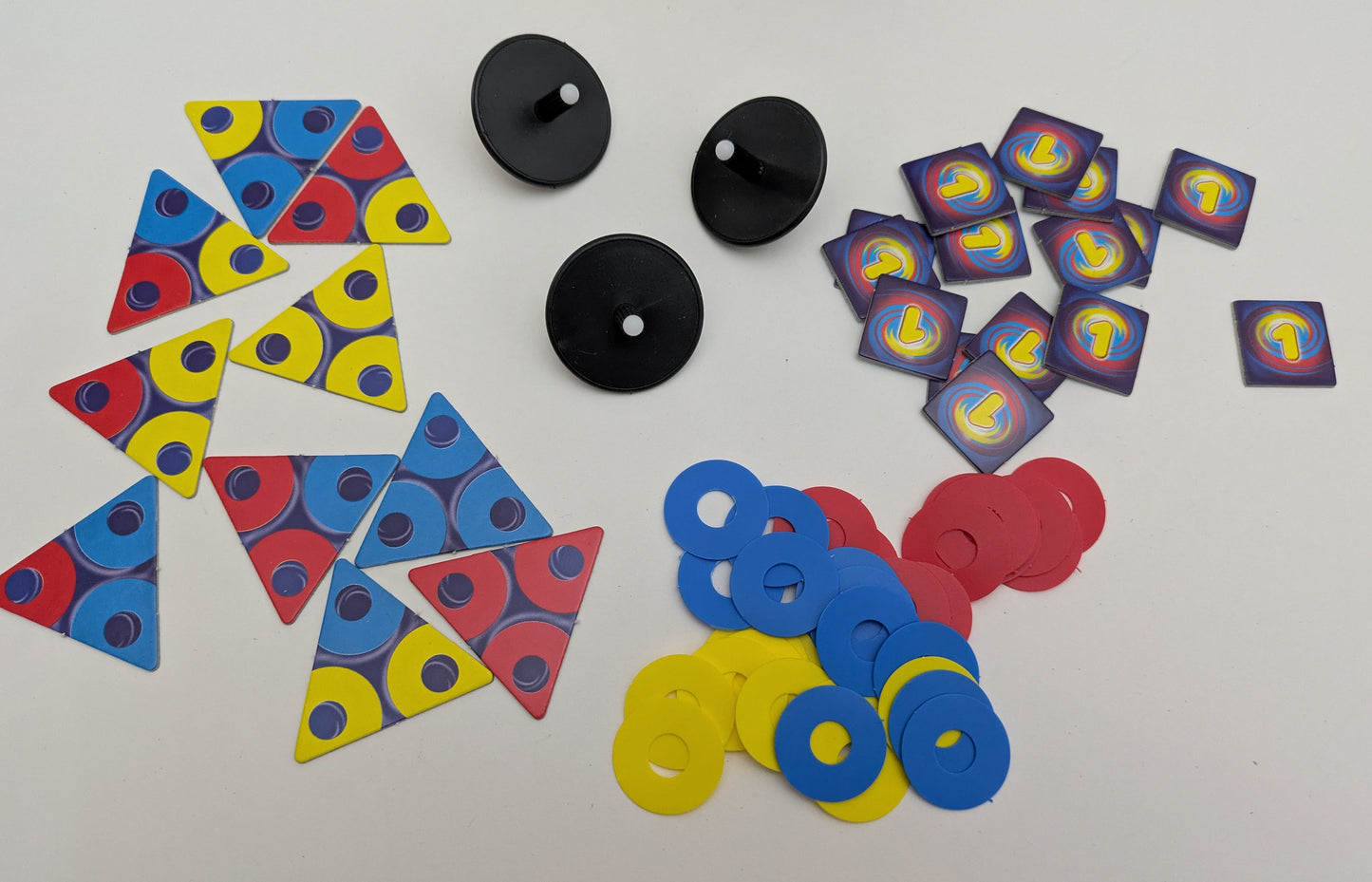 See the bright contents of Tops (2002), including spinning tops, discs, task cards, and point chips.