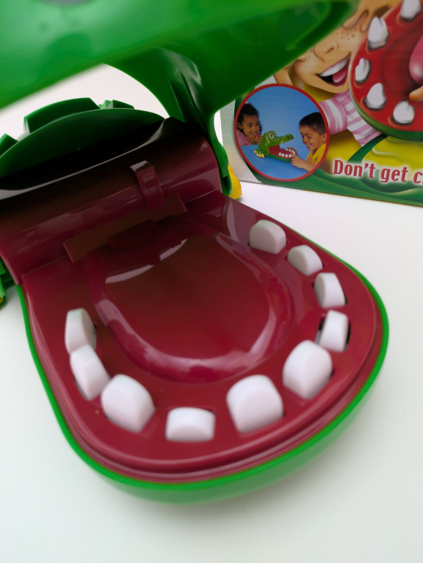 Take turns pressing teeth and avoiding the chomp in Crocodile Dentist (2011), a classic game of suspense.