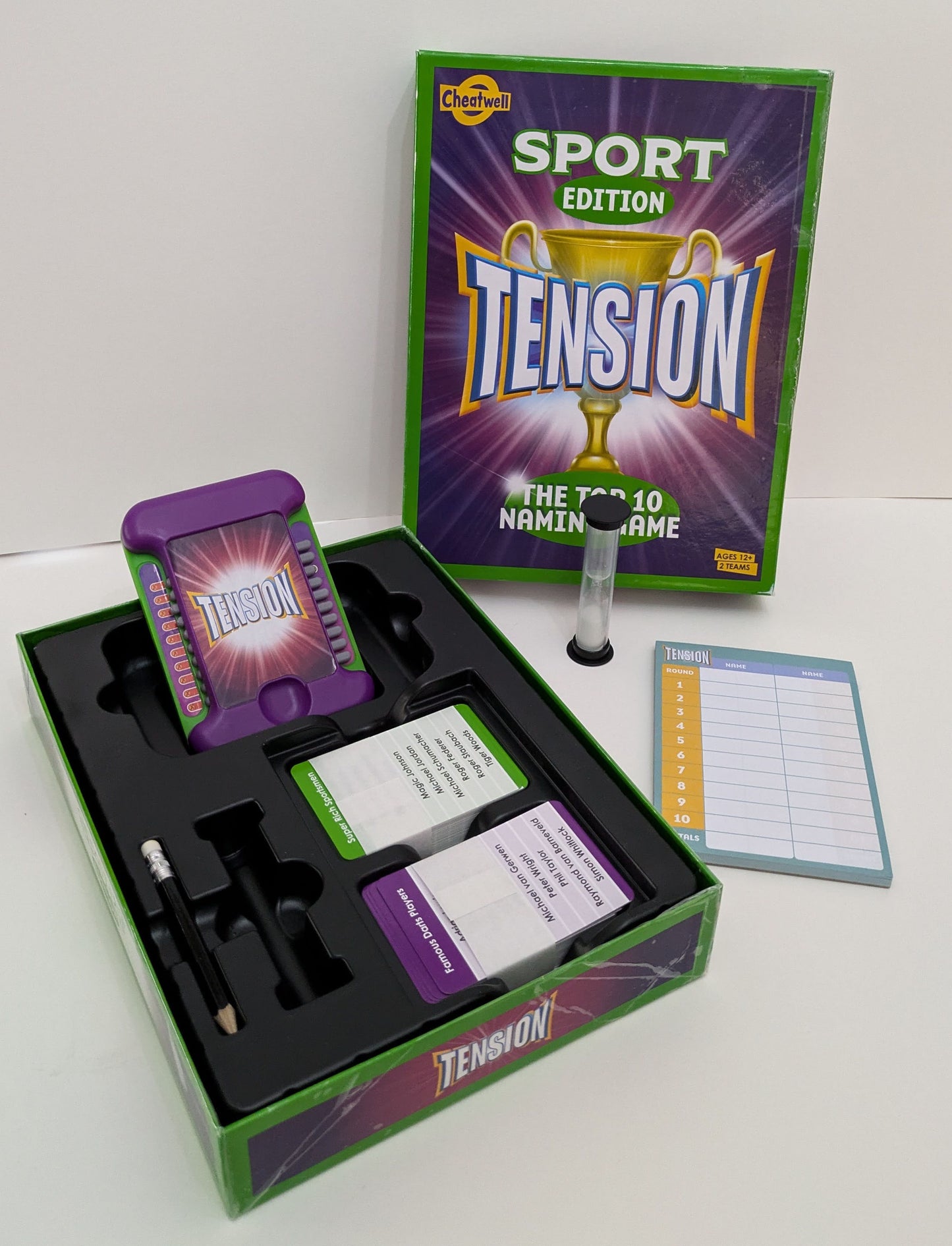 "Complete Tension: Sport Edition game setup with category cards, timer, and score sheets ready for a thrilling sports trivia challenge."