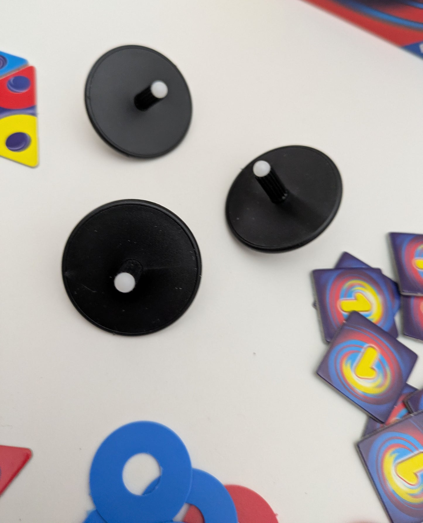 The excitement begins as players spin the tops and race to place their discs in Tops (2002).