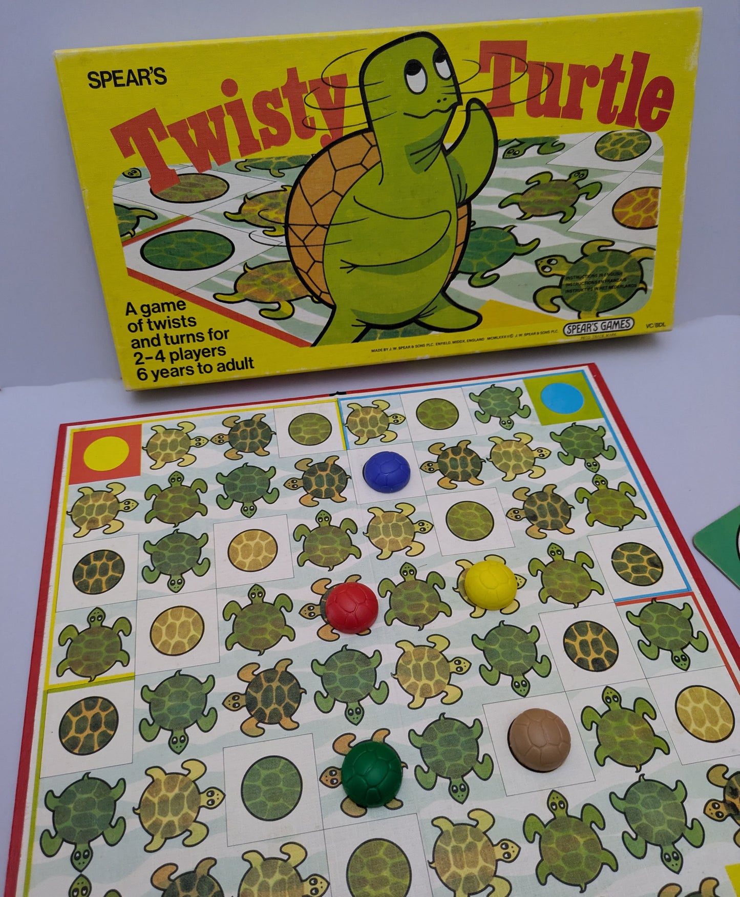 "Twisty Turtle (1982) game box featuring colourful turtles and a race-themed game board, highlighting fun and competitive gameplay."