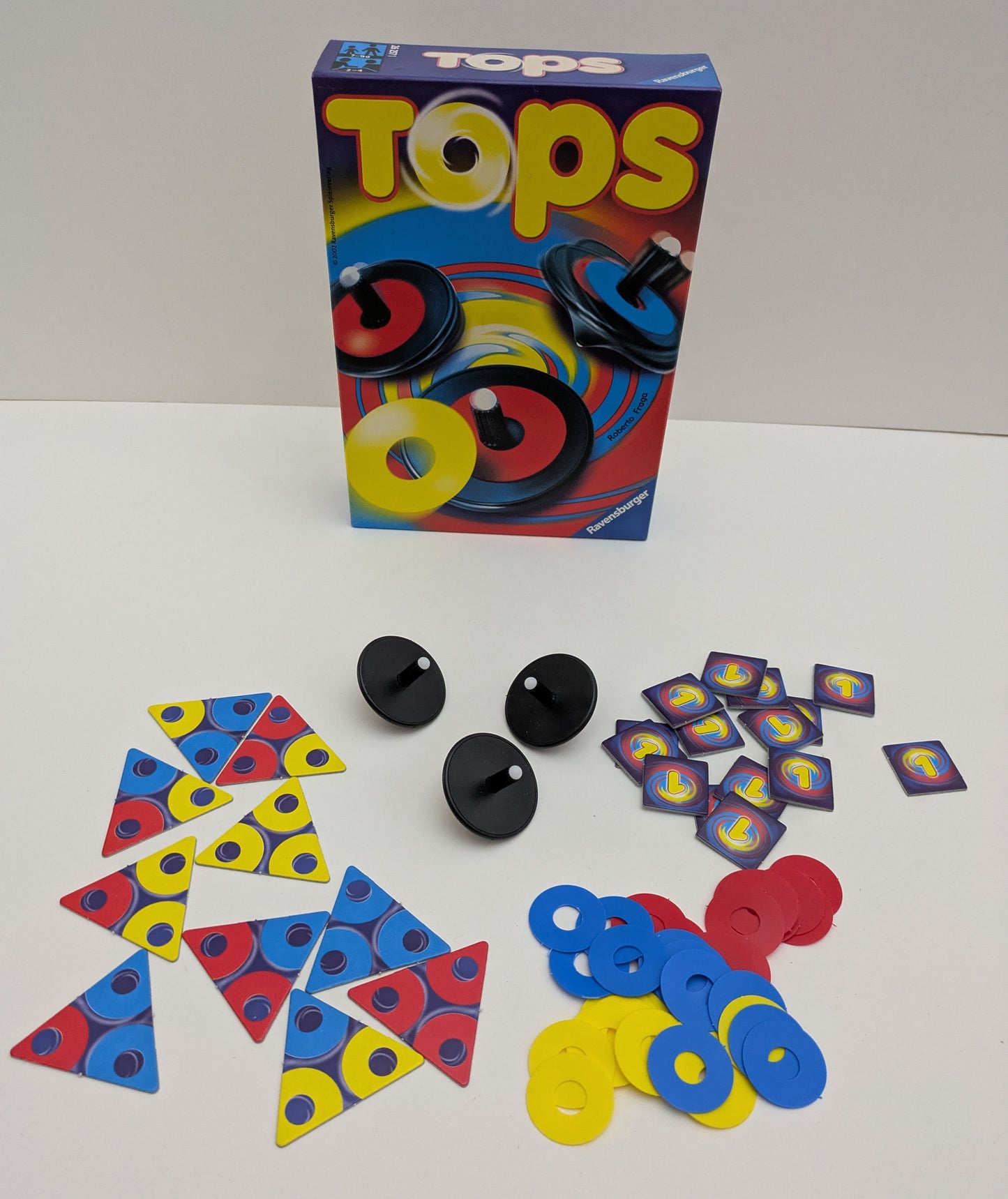 Watch the colourful discs spin and match in Tops (2002), a game full of energy and fun.