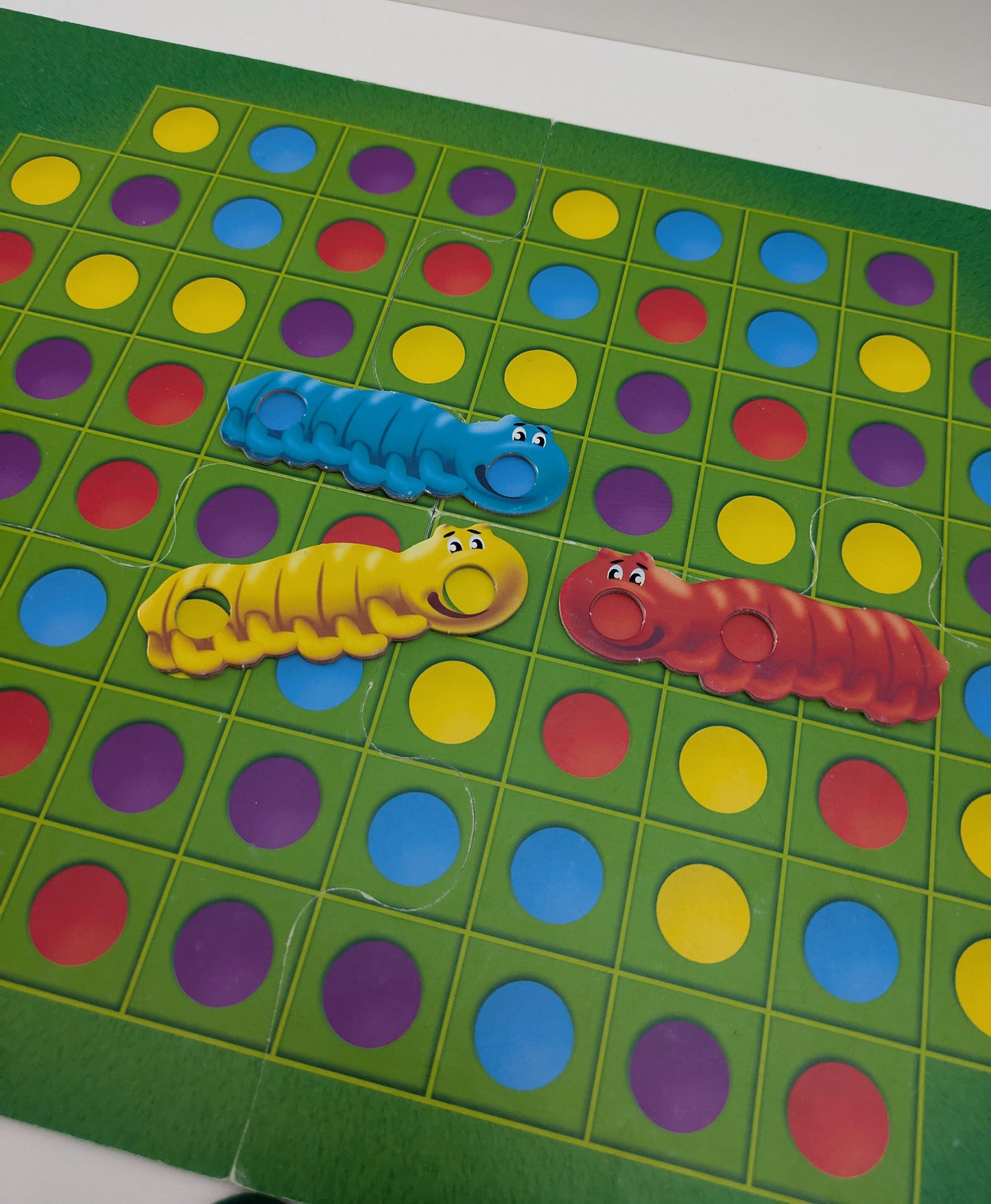 Watch your little ones light up as they play Colourful Caterpillars (1986)