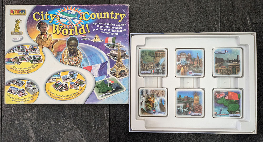 "Complete City Country World game setup with game board, trivia cards, and player pieces ready for an exciting geography learning adventure."