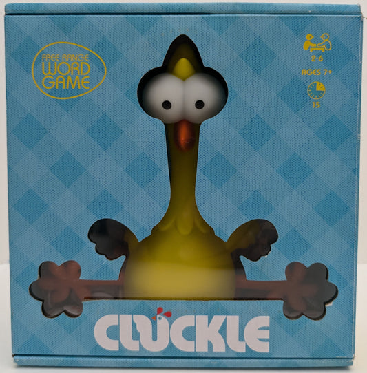 "Complete Cluckle (2021) game setup with egg tiles, rubber chicken, and scoring board ready for a fast-paced word creation race."