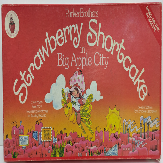 Complete setup of Strawberry Shortcake in Big Apple City with game board, character tokens, spinner, and pie cards ready for family-friendly gameplay.