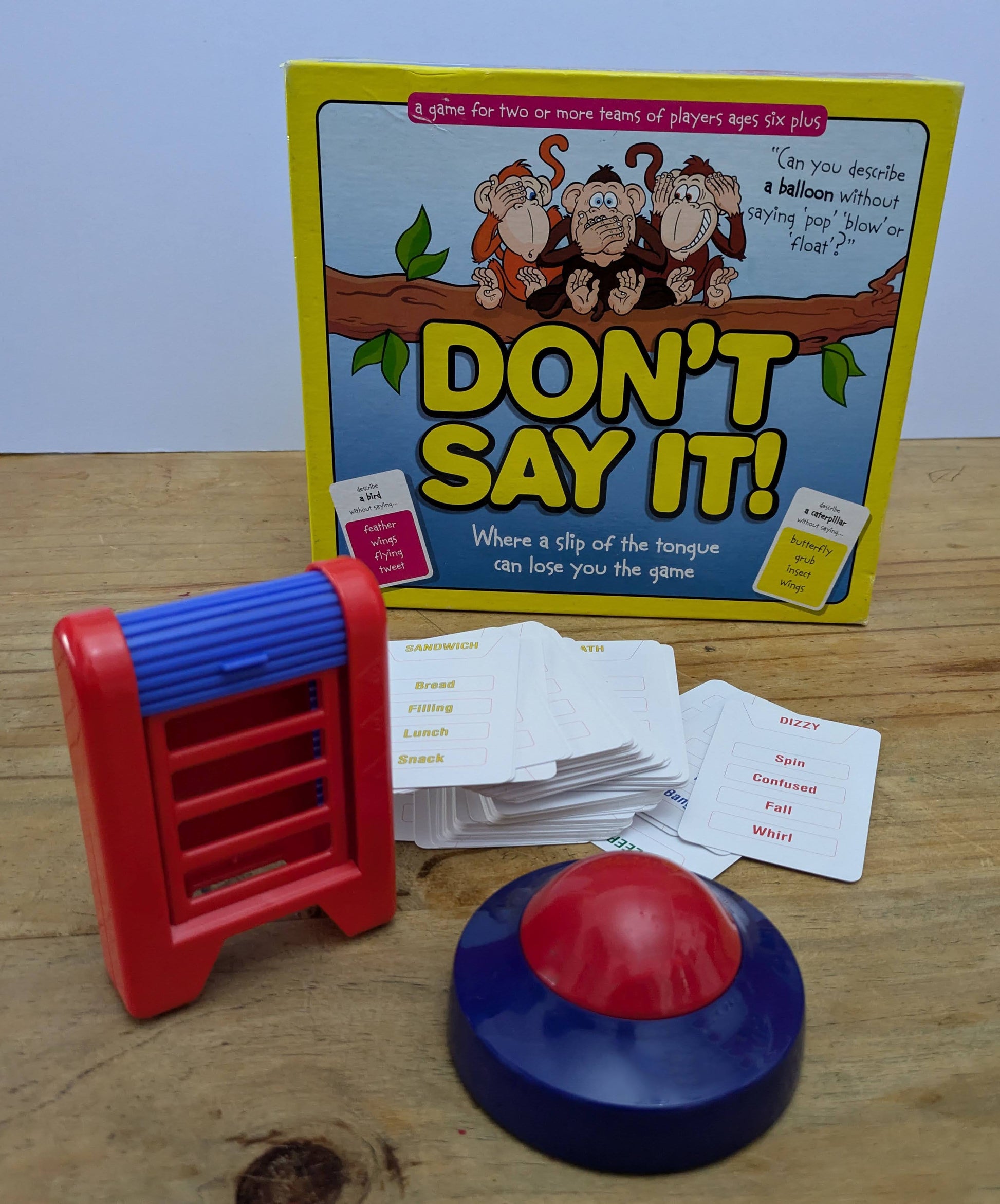 Complete Don’t Say It (2008) game setup with word cards, timer, and scoring pads ready for a hilarious family word challenge.