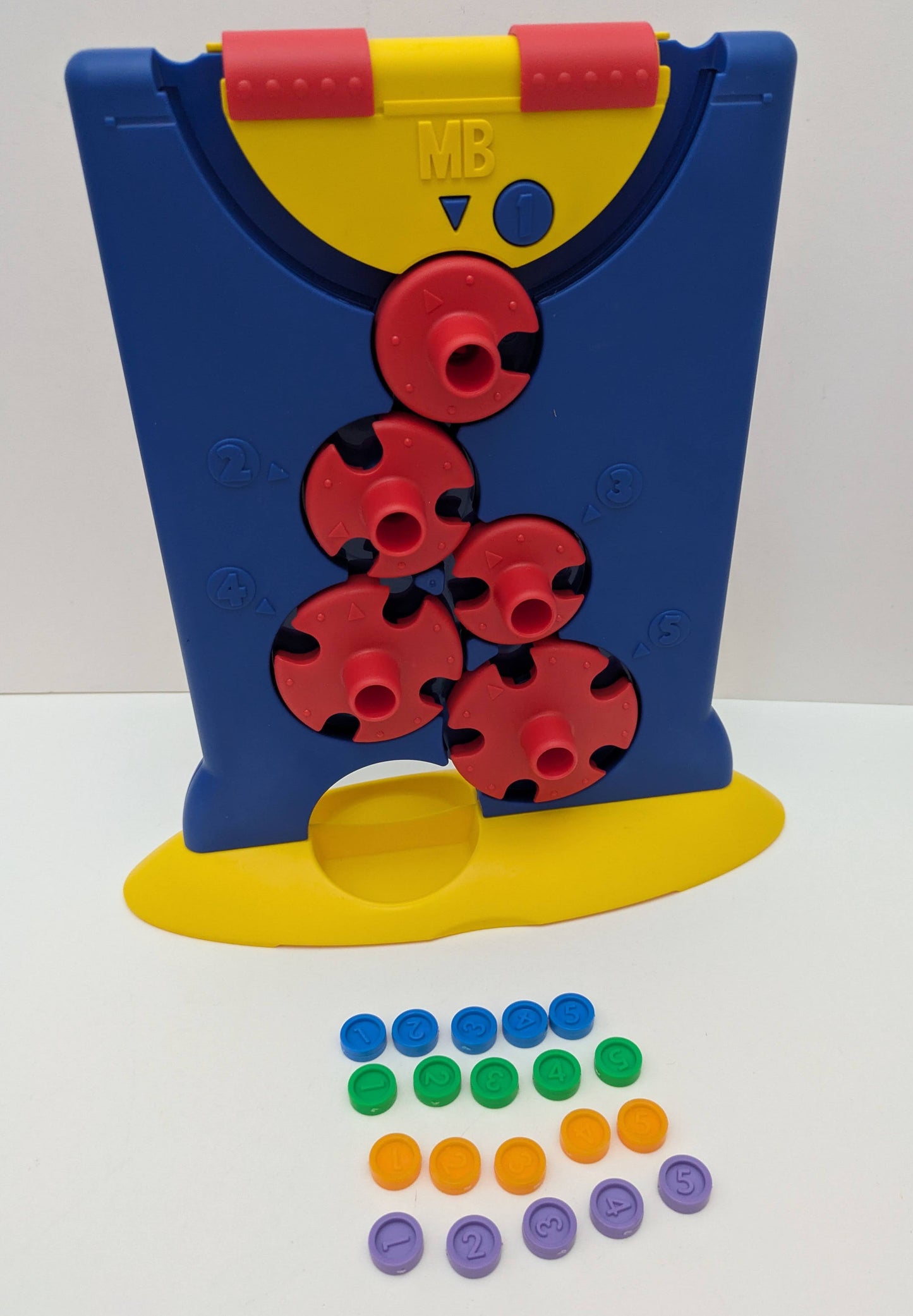 Downfall (1999) is a classic strategy board game where players twist numbered wheels to guide counters through changing paths.