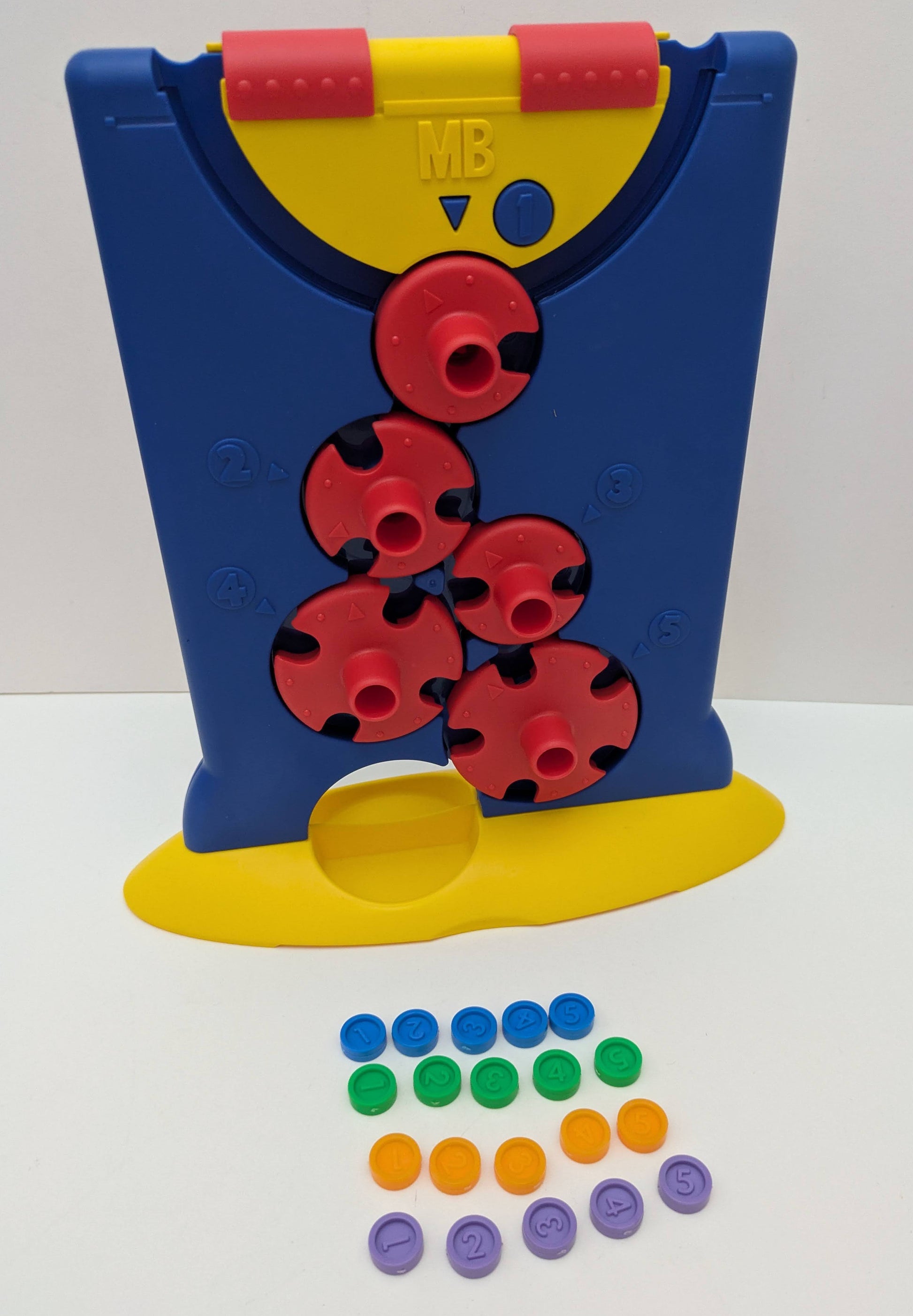 Downfall (1999) is a classic strategy board game where players twist numbered wheels to guide counters through changing paths.