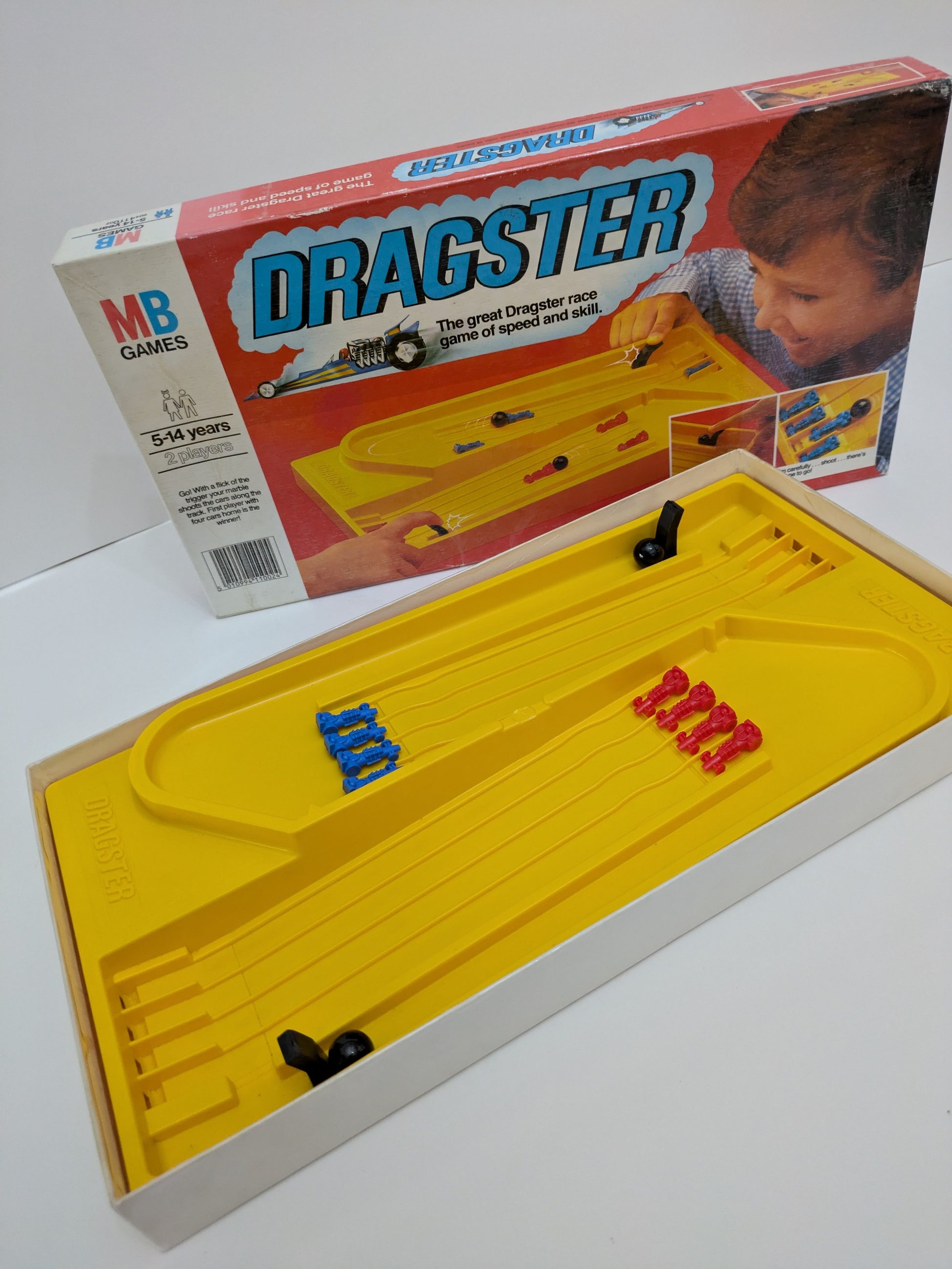 Complete Dragster (1976) game setup with racing track, marble shooters, and cars ready for an action-packed race.