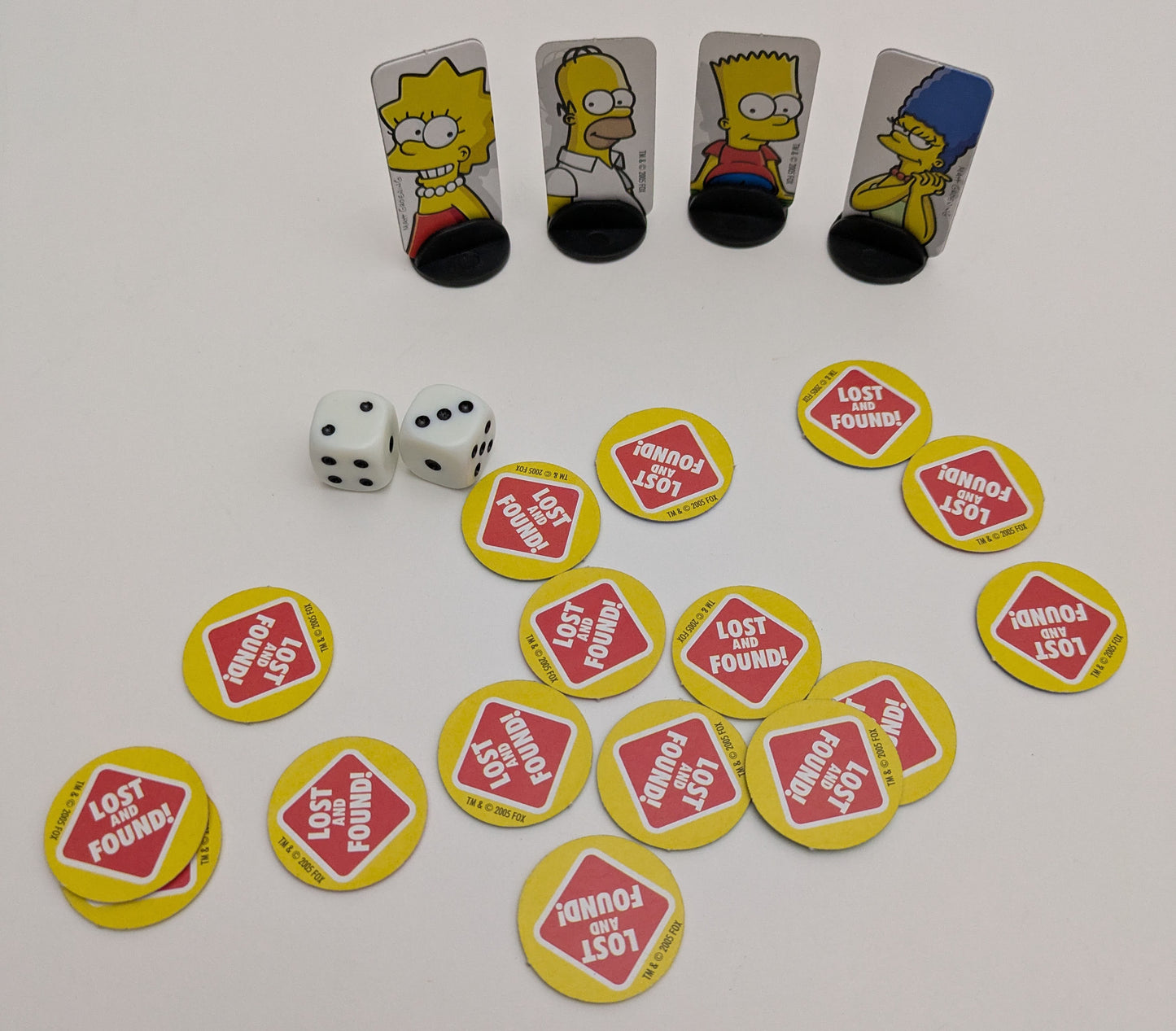 Hunt for missing items with Homer, Marge, Bart, Lisa, and Maggie in The Simpsons – Lost and Found (2005).