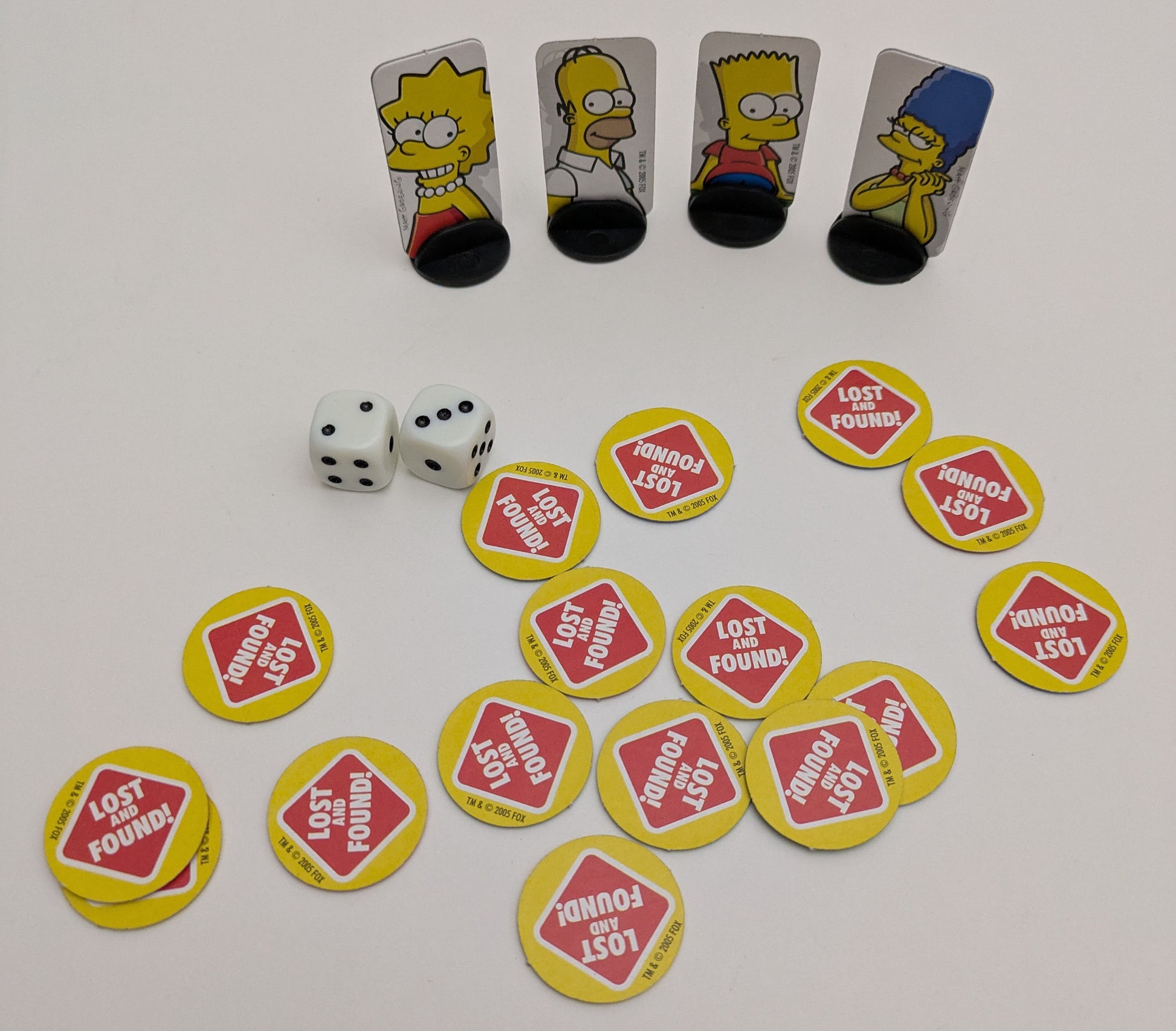 Hunt for missing items with Homer, Marge, Bart, Lisa, and Maggie in The Simpsons – Lost and Found (2005).