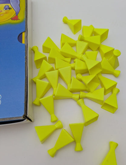 In Glo Friends Matching Pairs (1985), players take turns flipping tokens to find pairs – the one with the most matches wins!