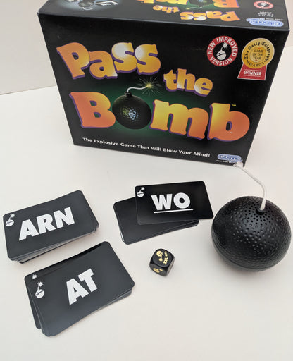 Inside Pass the Bomb (1994) you’ll find letter cards, a special die, and of course the ticking bomb.