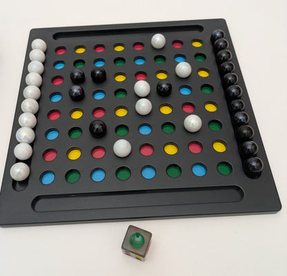 Joggle (2010) – The colourful marble strategy game that mixes luck and logic.