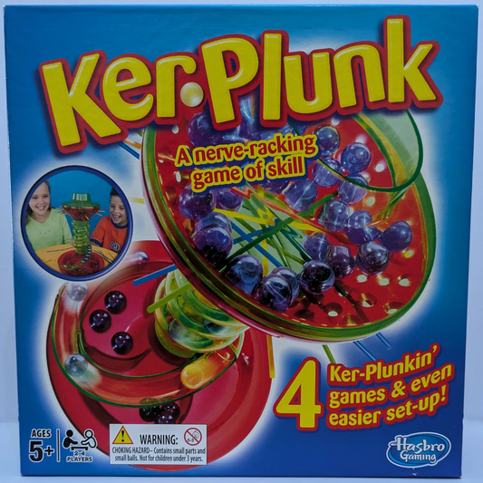 KerPlunk (2013) game box featuring colourful marbles, crisscrossed sticks, and the game logo highlighting its suspenseful gameplay.