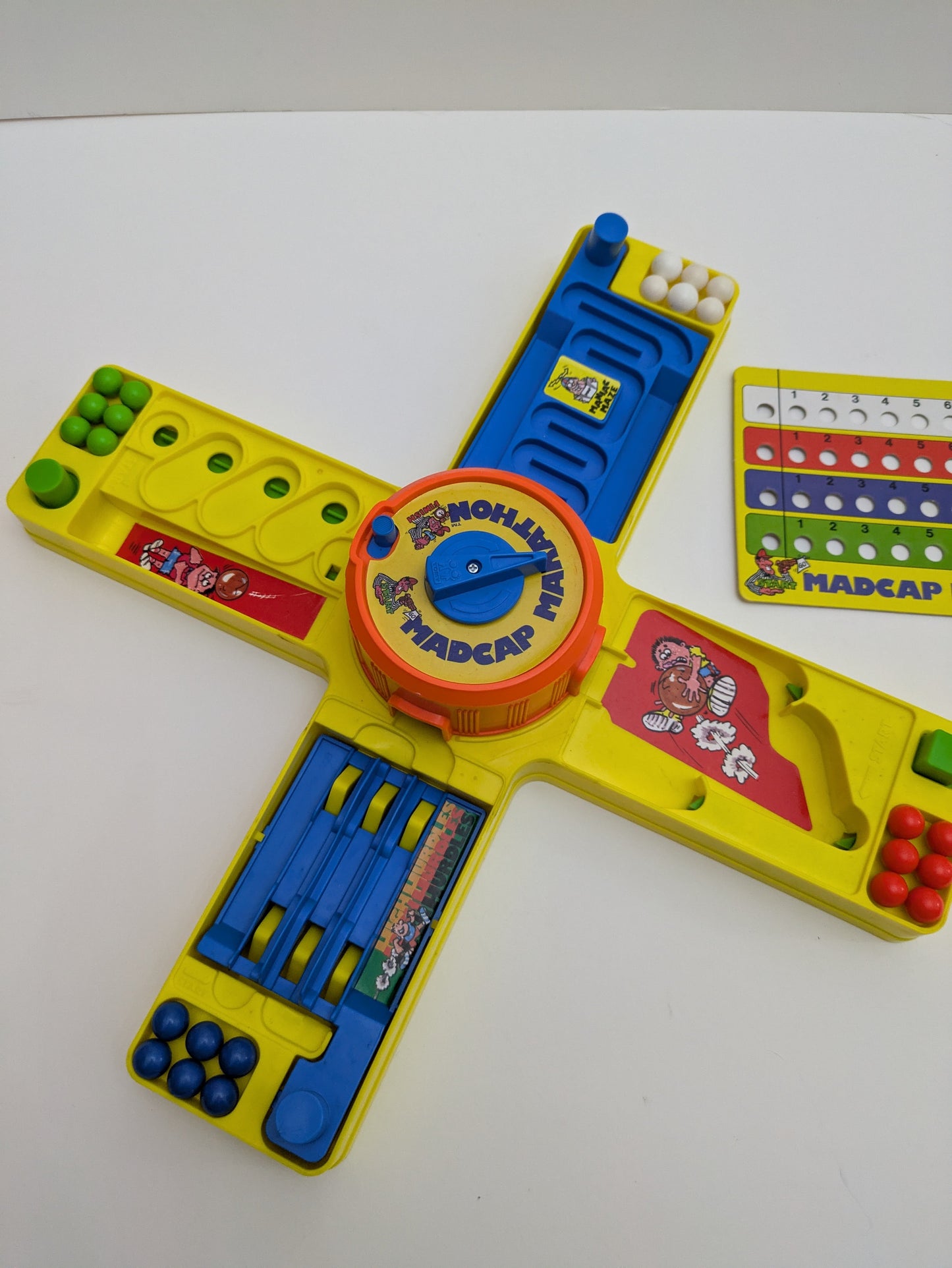 Complete Madcap Marathon setup with four obstacles, marble controls, and timer ready for action-packed solo or group gameplay.
