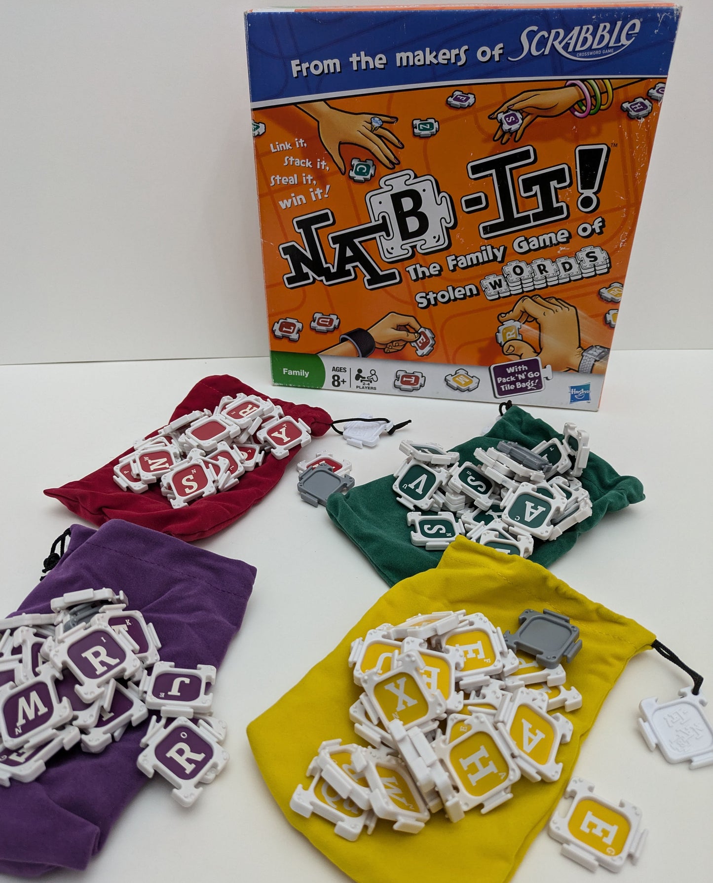 "Complete Nab-It (2010)  stacking words, and scoring board ready for exciting word-building competition."