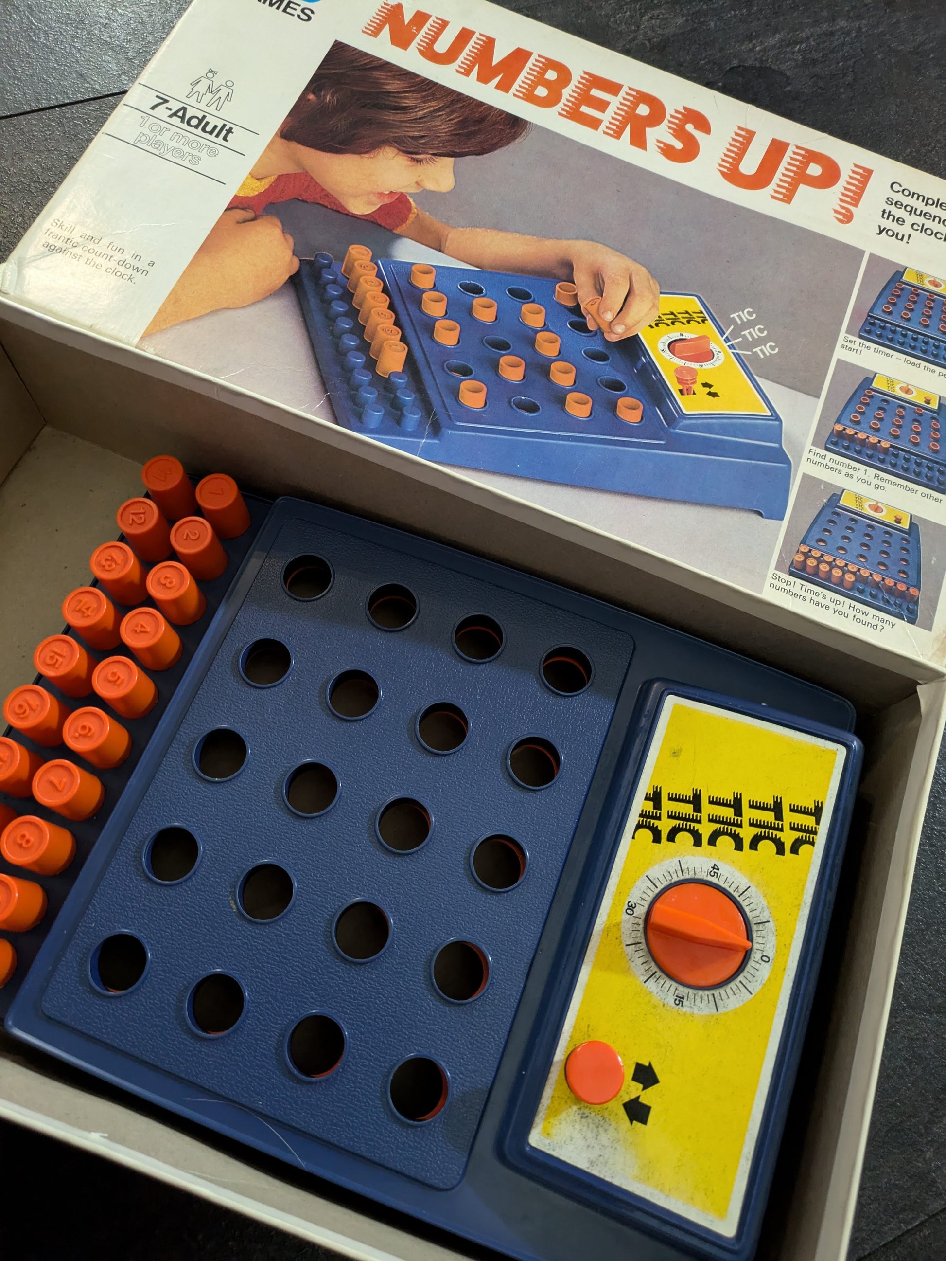 Complete setup of Numbers Up (1973) with colourful pegboard and numbered pegs ready for a fast-paced memory challenge.