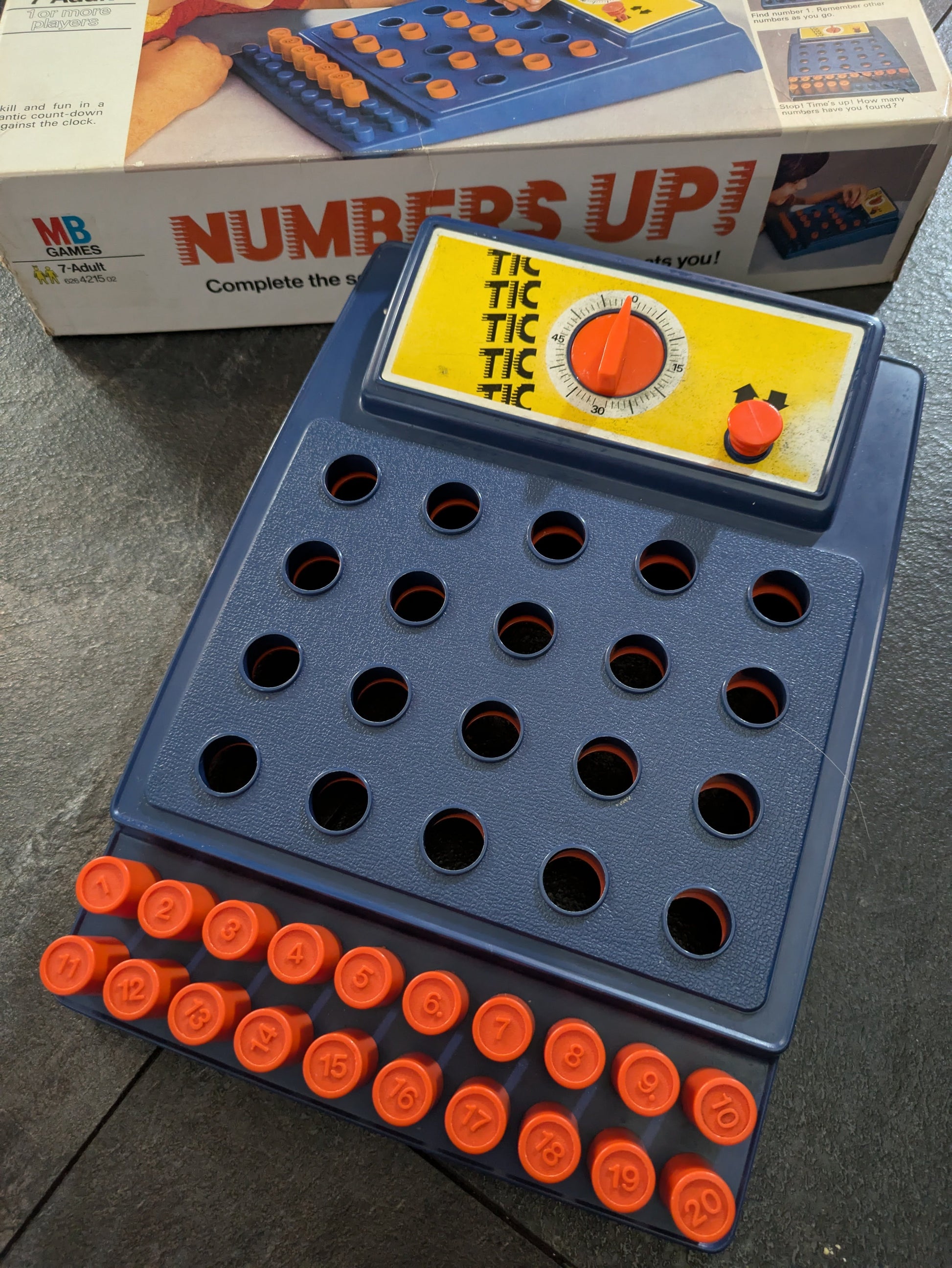 Complete setup of Numbers Up (1973) with colourful pegboard and numbered pegs ready for a fast-paced memory challenge.