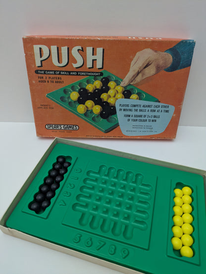 Outsmart your opponent with every move in Push (1977) – the classic game of strategy and skill.