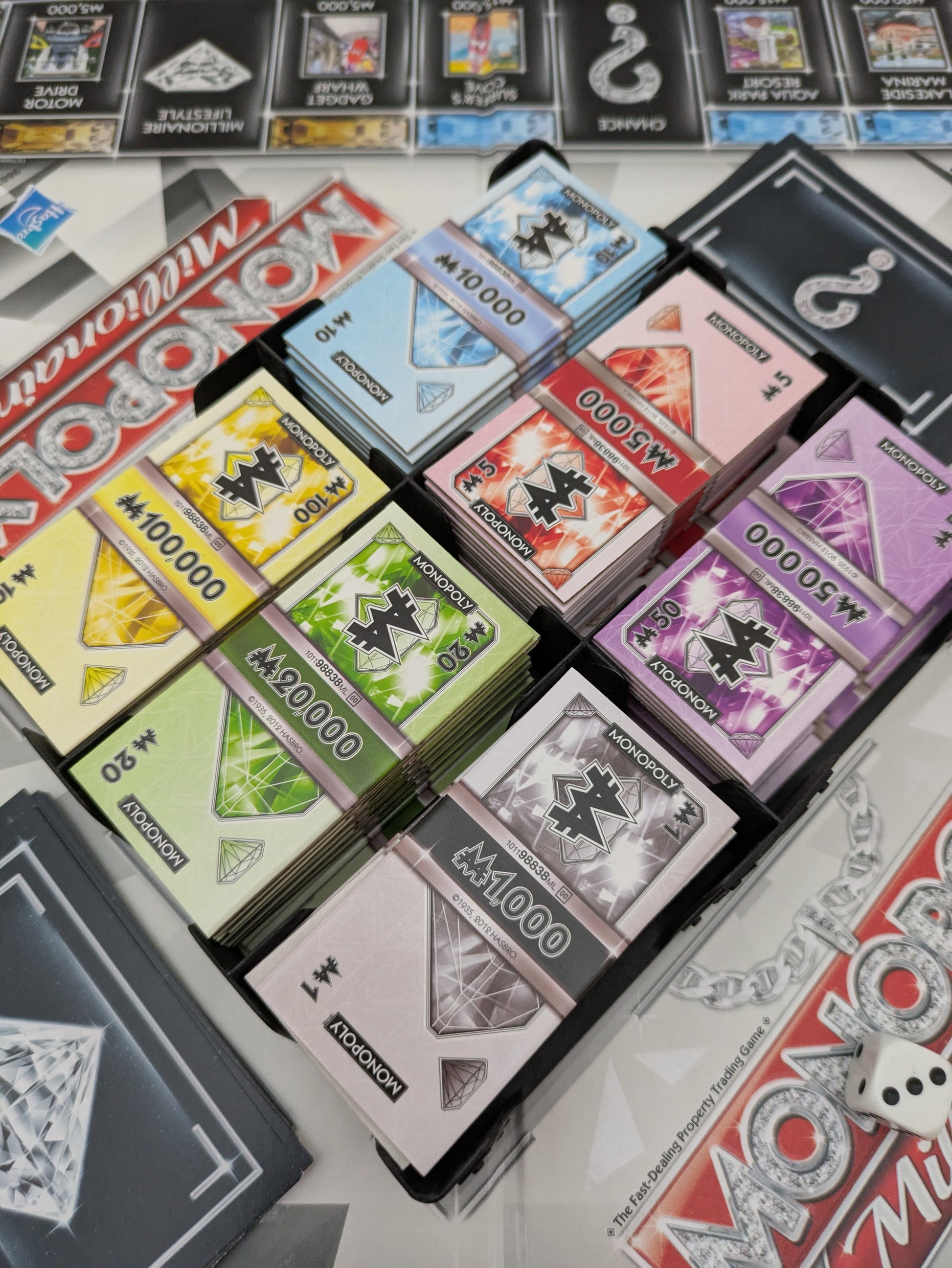 Reach a million first in Monopoly Millionaire (2012) – no bankruptcies needed!