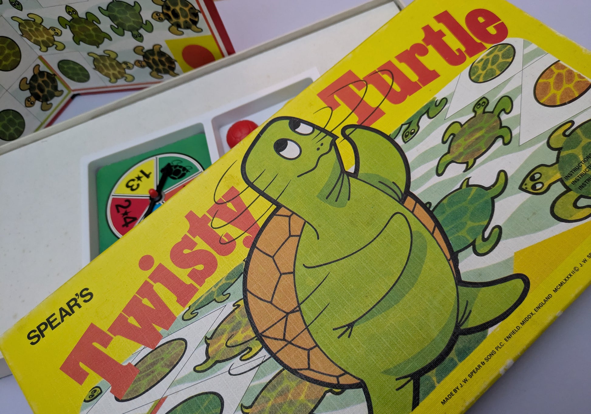 "Twisty Turtle (1982) game box featuring colourful turtles and a race-themed game board, highlighting fun and competitive gameplay."