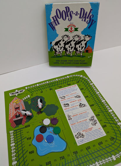 "Complete Whoops-a-Daisy (1981) game setup with farm-themed board, cow figurines, and scoring track ready for a fun cow-tossing competition."
