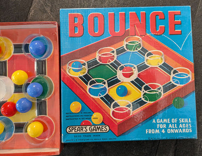 "Bounce (1960) game setup showing balls and box ready for play."