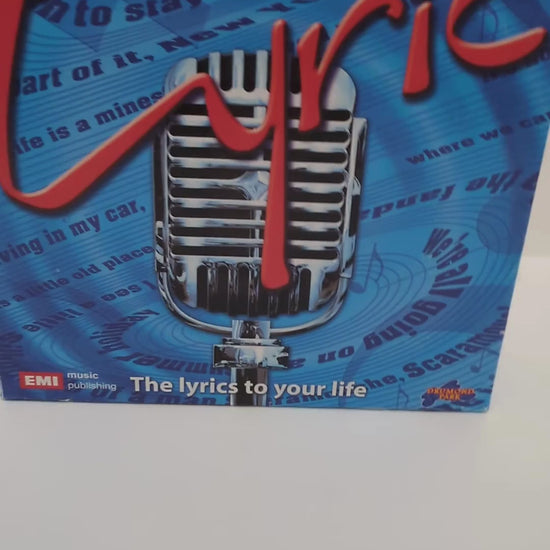 Complete Lyric (2007) game setup with quiz cards, timer, and musical elements ready for an interactive and fun game night.